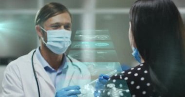Animation of data processing over diverse doctor and patient taking covid test. Global medicine, healthcare and digital interface concept digitally generated video.