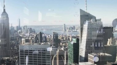 Animation of infographic interface over aerial view of cityscape against clear sky. Digital composite, multiple exposure, skyscraper, global, report, business, abstract and technology concept.
