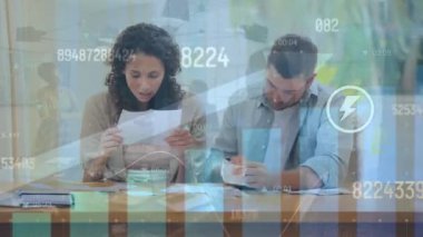 Animation of data processing over caucasian couple working at home. Global business and digital nterface concept, digitally generated video.