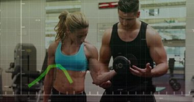 Animation of financial data processing over caucasian man and woman exercising in gym. Global sports, business, finance, computing and data processing concept digitally generated video.