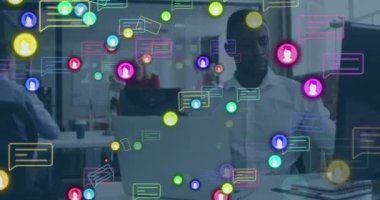 Animation of social media icons and data processing over businessman using laptop. Global social media, business, finance, computing and data processing concept digitally generated video.