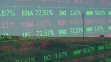 Animation of trading board over rotating windmills on green land against clear sky. Digital composite, multiple exposure, stock market, green energy, conservation and technology concept.