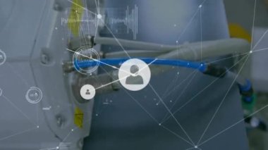 Animation of connected icons and dots with lines, graphs, changing numbers on back panel of machine. Digital composite, multiple exposure, communication, abstract, timer and technology concept.