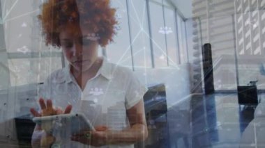 Animation of data processing and cityscape over african american businesswoman in office. Global business and digital interface concept digitally generated video.