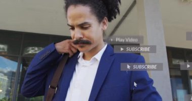 Animation of social media icons with texts over biracial businessman using tablet. Global social media, technology and digital interface concept digitally generated video.