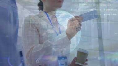 Animation of trading board, binary codes on caucasian female woman handing business card to man. Digital composite, multiple exposure, globe, globalization, stock market, coding and technology.