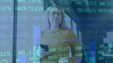 Animation of financial data processing over businesswoman using smartphone in office. Global business, finance, computing and data processing concept digitally generated video.