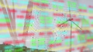 Animation of globe, graphs, trading board over alarm clock against rotating windmill on green land. Digital composite, multiple exposure, stock market, report, time, renewable energy, technology.