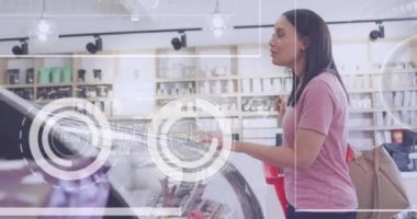 Animation of data processing over diverse shop assistant and customer talking. Global business and digital interface concept digitally generated video.