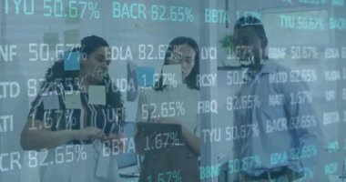 Animation of trading board, infographic interface, diverse coworkers sharing ideas on digital tablet. Digital composite, multiple exposure, stock market, business, teamwork, communication, technology.