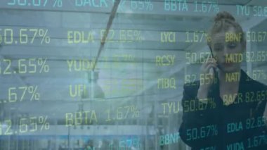 Animation of statistics and data processing over caucasian businesswoman using smartphone. Global business, finances, computing and data processing concept digitally generated video.