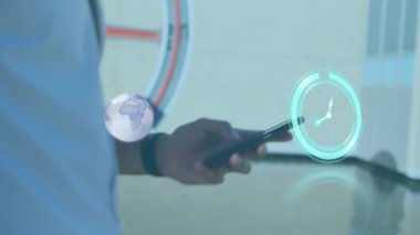 Animation of globe and clock over businessman using smartphone. Global connections, business, finance, computing and data processing concept digitally generated video.