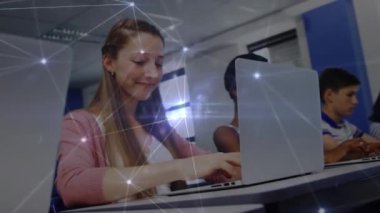 Animation of connected dots over multiracial students typing on keyboard in computer laboratory. Digital composite, multiple exposure, communication, childhood, education and technology concept.