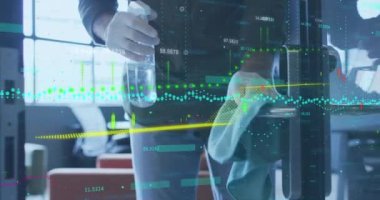 Animation of financial data processing over woman in gloves disinfecting office. Global covid 19 pandemic, business, finance, computing and data processing concept digitally generated video.
