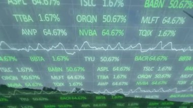 Animation of trading board over rotating windmill on green mountain against clear sky. Digital composite, multiple exposure, stock market, green energy, conservation and technology concept.