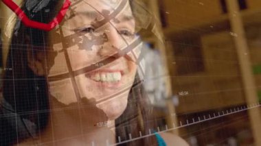 Animation of financial data processing and red line over woman using smartphone. Global connections, business, finance, computing and data processing concept digitally generated video.