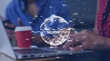 Animation of globe with business texts over diverse business people in office. Global business and digital interface concept digitally generated video.