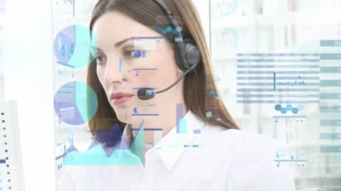 Animation of financial data processing over caucasian businesswoman using phone headset in office. Global business, finance, computing and data processing concept digitally generated video.