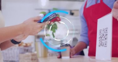 Animation of scope scanning over diverse shop assistant and customer paying with smartphone. Global business and digital interface concept digitally generated video.