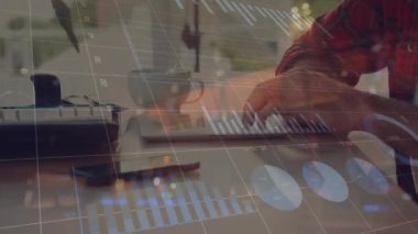Animation of statistical data processing over mid section of man using digital tablet at office. Business data technology concept