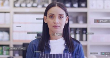 Animation of media icons over caucasian female shop assistant smiling. Global business and digital interface concept digitally generated video.