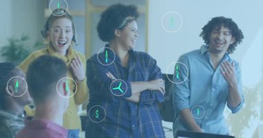 Animation of ecology icons over diverse business people in office. Global business and digital interface concept digitally generated video.