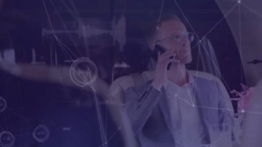 Animation of connected dots and graphs on caucasian business people talking on smartphone. Digital composite, multiple exposure, communication, abstract and technology concept.