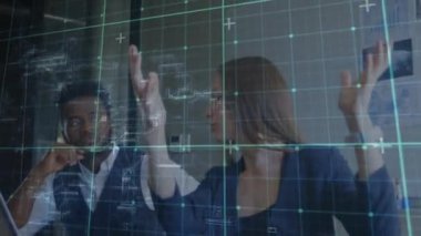 Animation of grid network over diverse businessman and businesswoman discussing at office. Computer interface and business technology concept