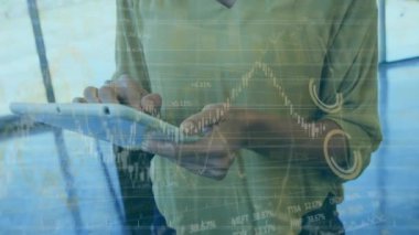 Animation of financial data processing over businesswoman using tablet in office. Global business, finance, computing and data processing concept digitally generated video.