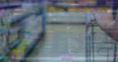 Animation of financial data processing over man with shopping trolley. Global shopping, business, finance, computing and data processing concept digitally generated video.