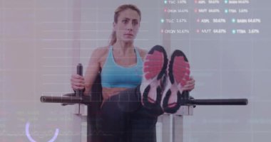 Animation of financial data processing over caucasian woman exercising in gym. Global sports, business, finance, computing and data processing concept digitally generated video.