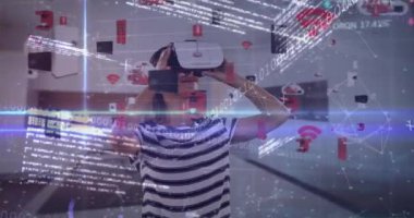 Animation of financial data processing over girl using vr headset. Global technology, computing and data processing concept digitally generated video.