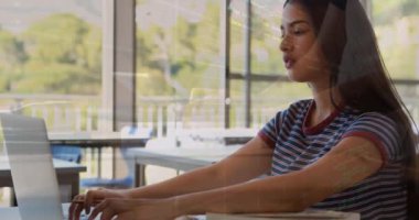 Animation of data processing over biracial schoolgirl sleeping by laptop in class. Global education, computing and data processing concept digitally generated video.