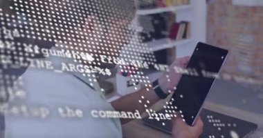 Animation of data processing over man using tablet. Global online security, business, finance, computing and data processing concept digitally generated video.