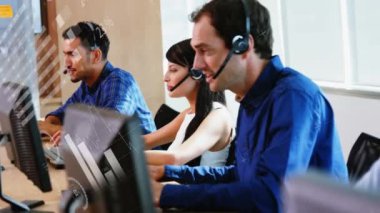 Animation of financial data processing over diverse business people using phone headsets in office. Global business, finance, computing and data processing concept digitally generated video.