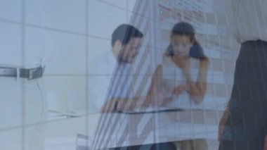 Animation of statistics and data processing over business people shaking hands. Global business, finance, computing and data processing concept digitally generated video.