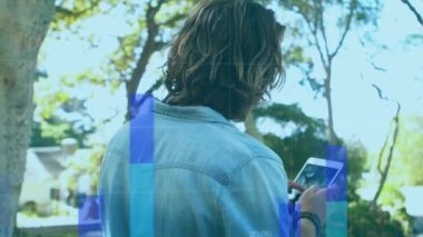 Animation of financial data processing over man using smartphone. Global connections, business, finance, computing and data processing concept digitally generated video.