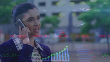 Animation of financial data processing over caucasian businesswoman using smartphone. Global business, finance, computing and data processing concept digitally generated video.