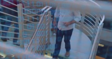 Animation of data processing over diverse business people on stairs in office. Global business and digital interface concept digitally generated video.
