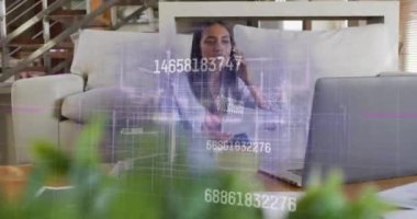 Animation of financial data processing over african american woman using laptop. Global lifestyle, finances and digital interface concept digitally generated video.