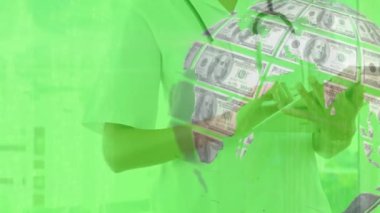 Animation of globe formed with american dollars over caucasian female doctor using smartphone. Global medicine, business, finance, computing and data processing concept digitally generated video.