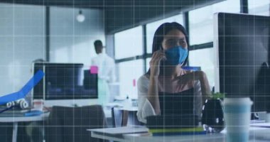 Animation of financial data processing over businesswoman in face mask using smarpthone. Global covid 19 pandemic, business, finance, computing and data processing concept digitally generated video.