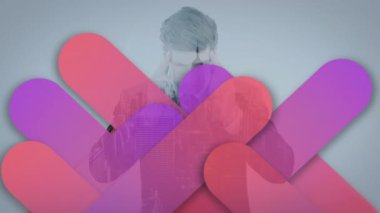 Animation of purple pattern over cityscape and businessman. Global business, finance, computing and data processing concept digitally generated video.