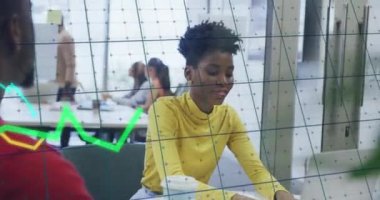 Animation of financial data processing over diverse business people discussing work at office. Global business, finances and digital interface concept digitally generated video.