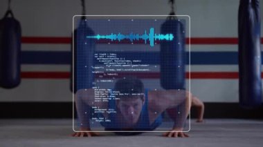 Animation of data processing over man doing press ups, exercising in gym. Global sports, fitness, computing and data processing concept digitally generated video.