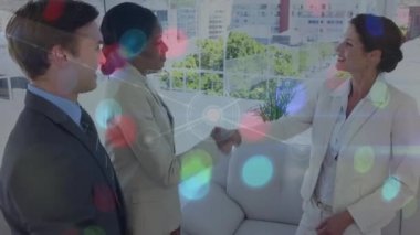 Animation of network of connections with icons over diverse business people in office. Global connections, business, finance, computing and data processing concept digitally generated video.