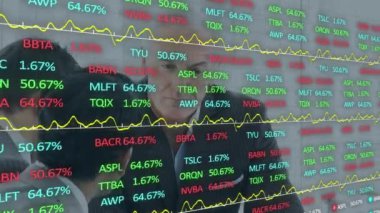 Animation of data processing over caucasian business people in office. Global business and digital interface concept, digitally generated video.