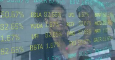 A group of people diverse in race and gender working together in a creative design business. Business technology and data processing concept digitally generated video.