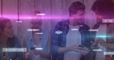 Animation of social media icons with texts over diverse people using smartphones. Global social media, technology and digital interface concept digitally generated video.