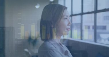 Animation of financial data processing over biracial businesswoman working in office. Global business, finance, computing and data processing concept digitally generated video.